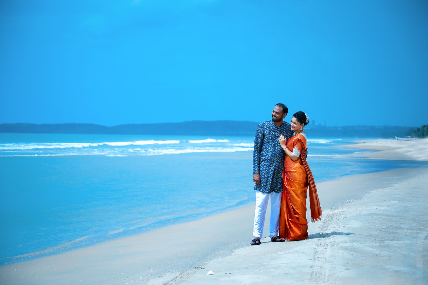 married couple standing together on a beach in South India