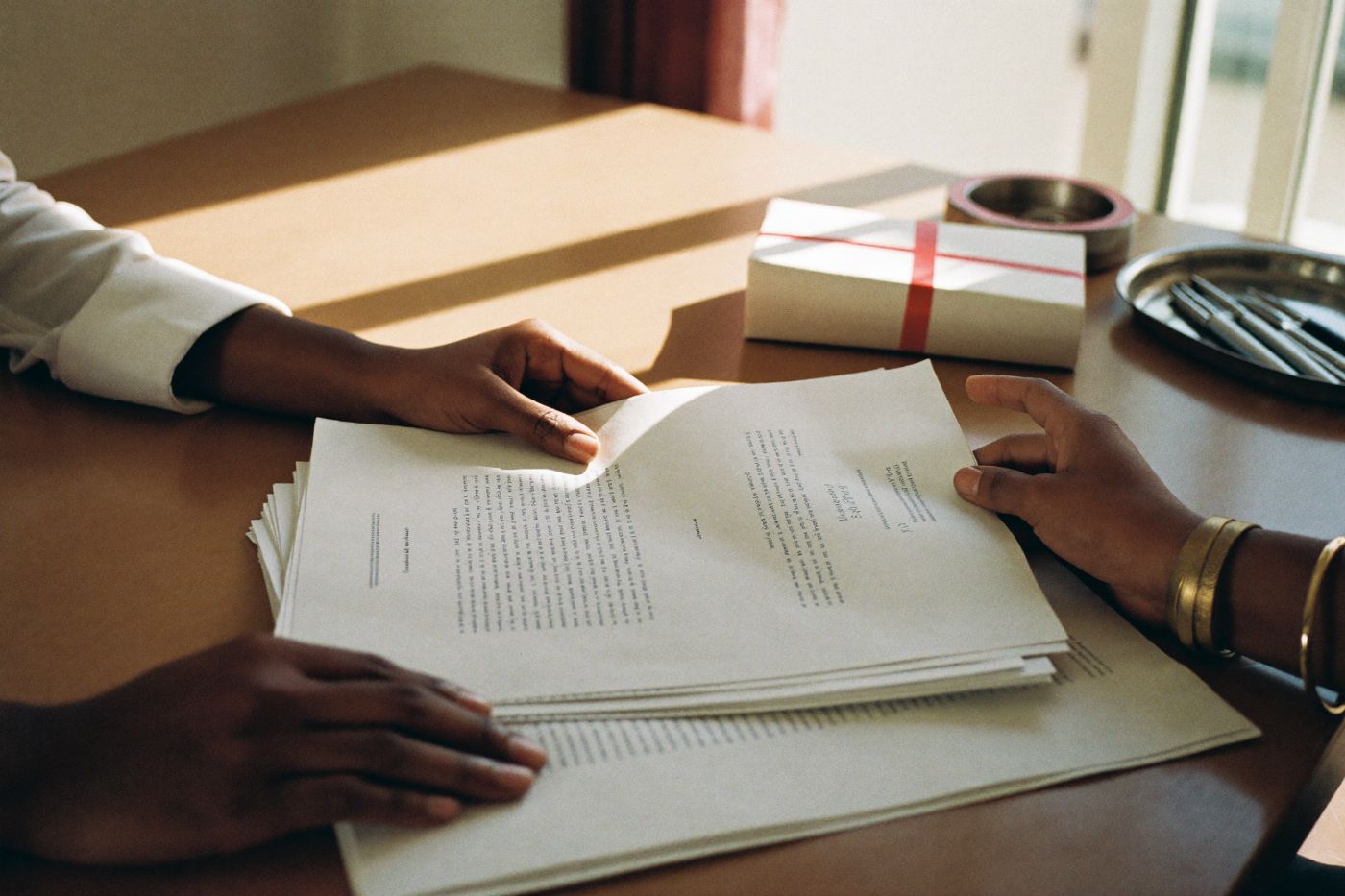 settlement papers signed across a table in a Chennai law office