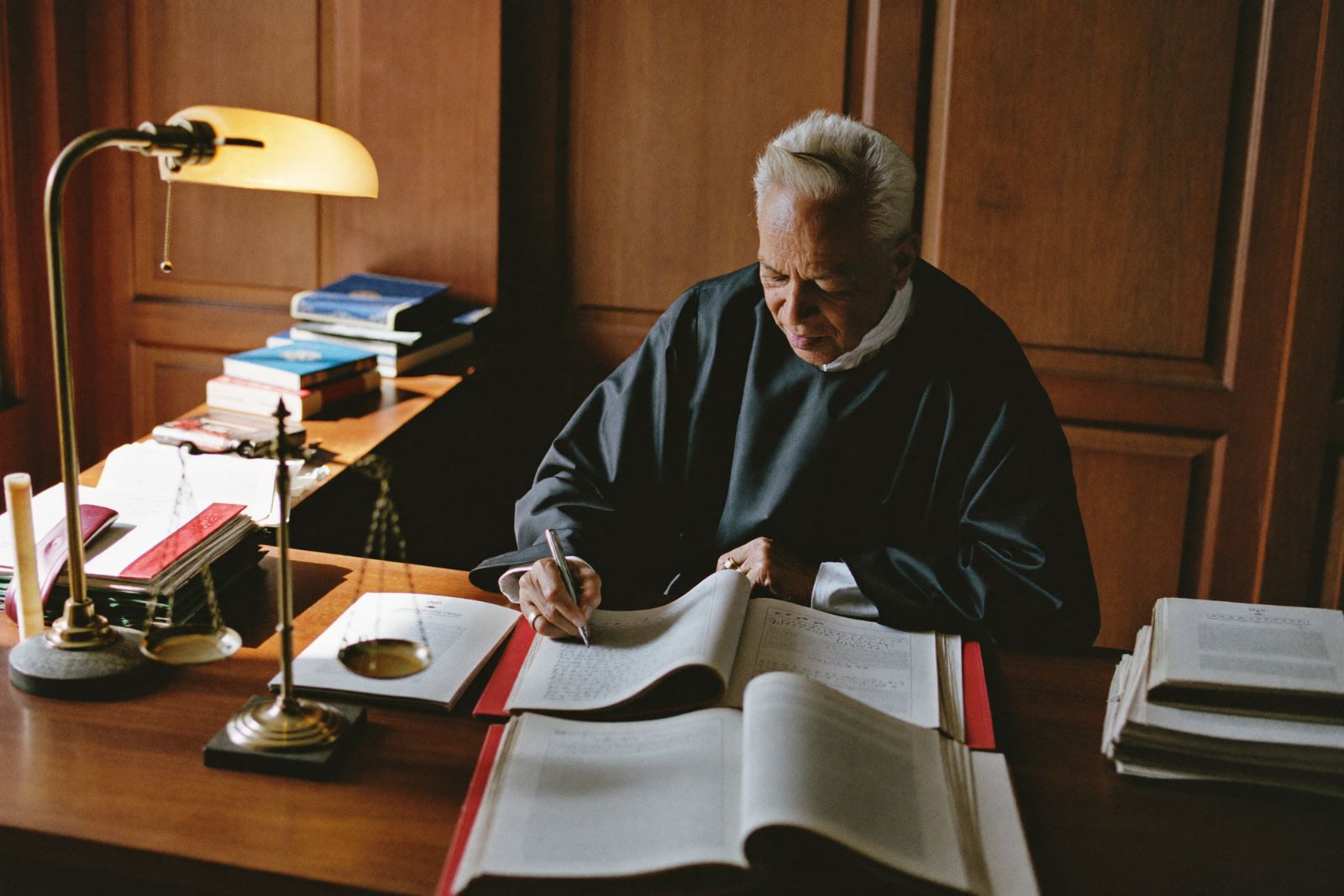 judge writing an order in a family court
