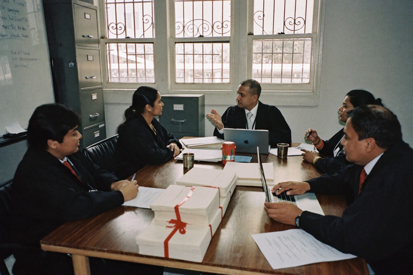 Advocates reviewing case files together at YUVA Law Firm, Chennai